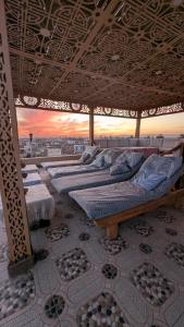a bedroom with a bed with a view of a city at Nagar Villa Apartments in Luxor