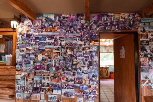 a wall full of pictures on a wall at Periko´s Youth Hostel in San Carlos de Bariloche +59 photos