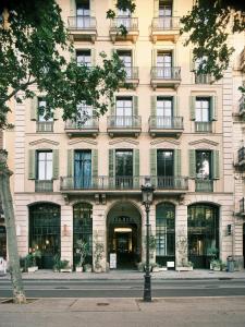 a large building with windows and a street light at Hotel Casa Bonay & Spa in Barcelona