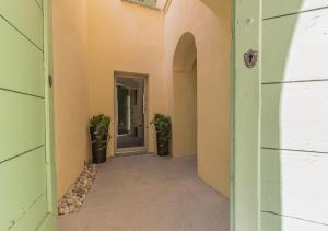 an empty hallway of a building with a doorway at La Corte Del Lario - Contrada Scoscesa in Varenna