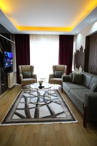 a living room with a couch and a table at Poli House in Kasaplar