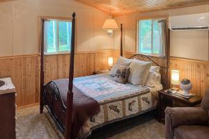 a bedroom with a bed and a couch at Mountain Escape in Sturgis