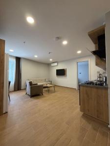 a large living room with a couch and a table at Mimoza Apart in Trabzon