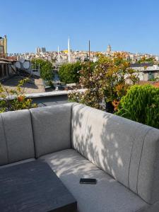 a couch sitting on top of a roof at Histavera Hotel in Istanbul