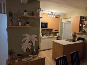 a kitchen with a island in the middle of a room at Ti a mor in Carnac +24 photos