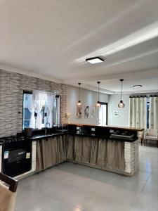 a kitchen with a sink and a counter top at Chácara pôr do sol in Araçoiaba da Serra