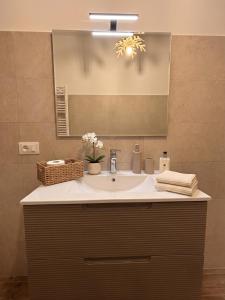 a bathroom with a sink and a mirror at Yes I Know My Room - La Rua in Castel di Sangro