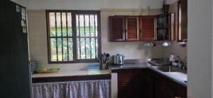 a kitchen with a sink and a counter top at Cabaña Las Lajas la pintada in La Pintada