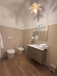 a bathroom with a sink and a toilet and a mirror at Yes I Know My Room - La Rua in Castel di Sangro