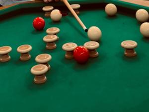 a billiard table with balls and a cue at The SeveraLena, your Tawas Point destination! in East Tawas