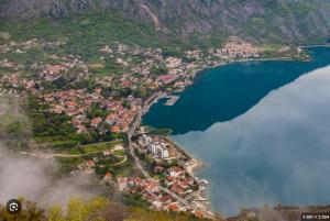 an aerial view of a town next to a body of water at Vista View Apartments in Risan