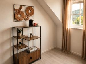 a shelf in a room with a window at Hotel zur Linde in Berghausen