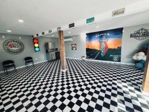 a room with a black and white checkered floor at Skyliner Motel in Stroud
