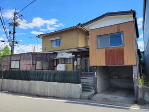 a house on the side of a street at おかえりヒュッテ in Komagane