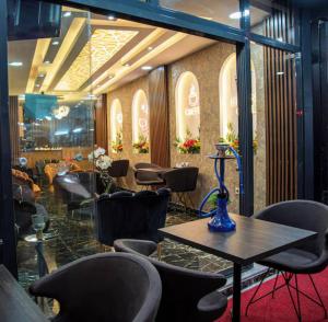 a restaurant with chairs and a table in a room at Histavera Hotel in Istanbul