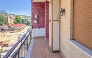 a balcony with a door and a brick wall at DeLiA in Avellino