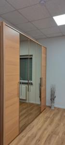 a large glass door in an empty room at Ferienwohnung Am Stadttor in Tann