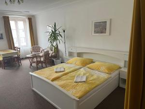 a bedroom with a bed with two plates on it at ubytování U Šeniglů in Telč