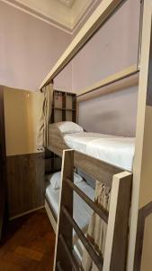 a couple of bunk beds in a room at BakuDowntownHostel in Baku +14 photos