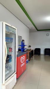 a store with a red refrigerator in a room at Hotel Goiamat in Querencia