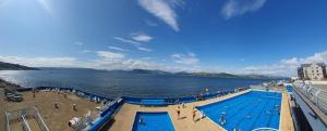 a swimming pool on a cruise ship in the water at Beautiful 2 double bedrooms, 2 baths apartment in Port Glasgow