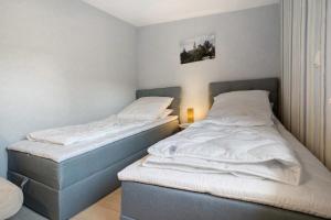 two twin beds in a room with at Fewo Gustav Melkert Str. 5A in Röbel