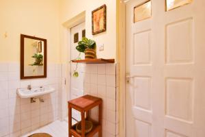a bathroom with a toilet and a sink at Utamaduni House B&B in Arusha +158 photos