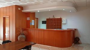 a bar in a room with a counter and a table at Edificio Mirasierra in Oropesa del Mar