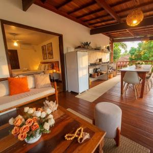 a living room with a couch and a table at Residência Thomas in Itacaré