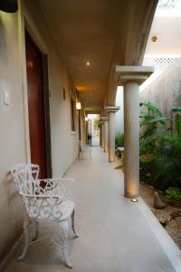 a hallway with a bench in a building at Petra By Ariché in Valladolid