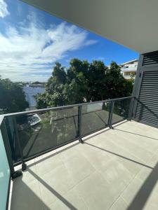 a balcony with a view of a city at Blue sunset - Appartement avec vue mer in Papeete