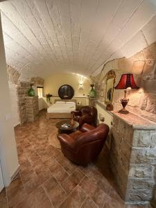 a large living room with a couch and a bed at Suite16 & spa in Barletta