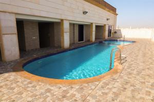a swimming pool in the middle of a building at Moments in Jeddah