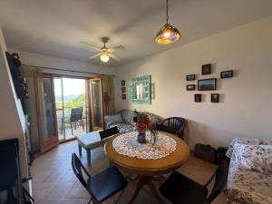 a living room with a table and a couch at La dorada 8 in Torroella de Montgrí +13 photos