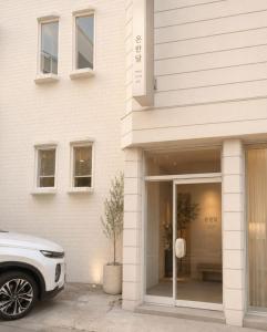a white car parked in front of a building at 온한달 in Seongnam