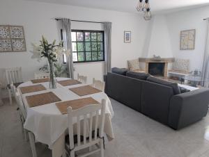 a living room with a table and a couch at Monte Madalena in Querença