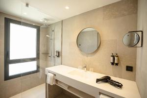 a bathroom with a sink and a mirror at La Chapelle in Annecy +55 photos
