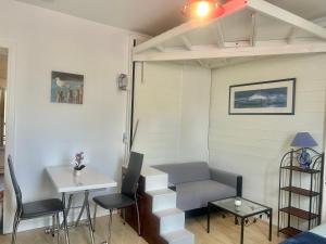 a living room with a couch and a table at Studio -Center - Lorient in Lorient