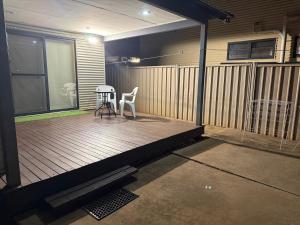a balcony with a table and chairs on a house at Broome Rest House in Broome +7 photos