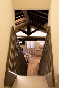 a hallway with a staircase in a building at Alnus in Valentano +25 photos