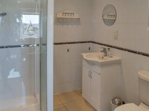 a bathroom with a shower and a sink and a toilet at Ivy No1 - Uk49251 in Althorne