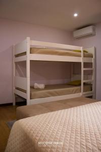 a bedroom with two bunk beds in a room at Quinta do Moinho in Castelo de Paiva +43 photos