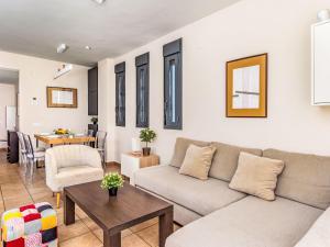 a living room with a couch and a table at Apartment Alamar by Interhome in La Cala de Mijas