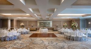 a banquet hall with white tables and chairs at Surf & Sand Laguna Beach in Laguna Beach +170 photos