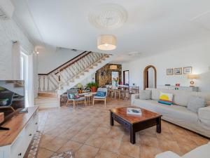 a living room with a couch and a table at Holiday Home Casa do Sol by Interhome in Patroves