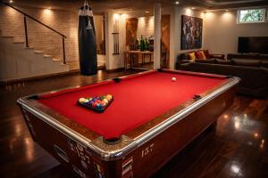 a pool table in a living room with a pool table at Fantastic 6B Villa in Sidi Daoud