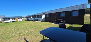a view of a row of mobile homes at Domki Ostoja in Rewal +3 photos