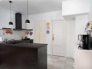 a kitchen with a black counter top in a room at Holiday Home Sol de Estepona by Interhome in Estepona