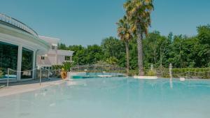 a large swimming pool with a slide in a house at Residence Relais du Lac Village & Elite in Desenzano del Garda