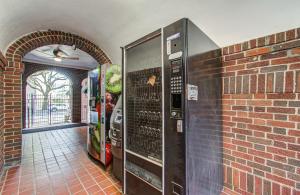 a brick wall with two vending machines in a hallway at Cute Downtown Stay near Toyota Center & Midtown in Houston